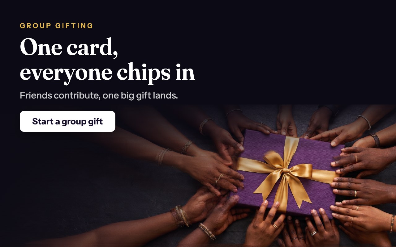 Friends’ hands together on one gold-ribboned gift — group gifting